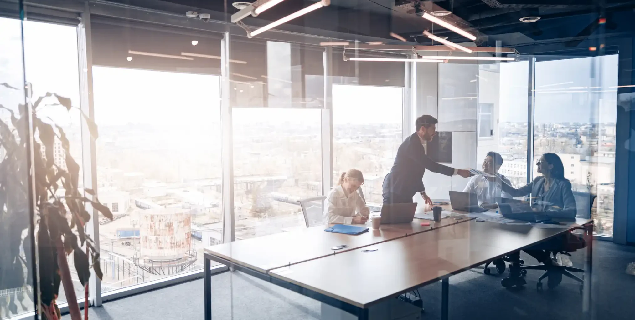 people-standing-near-table-team-young-businessmen-working-communicating-together-office